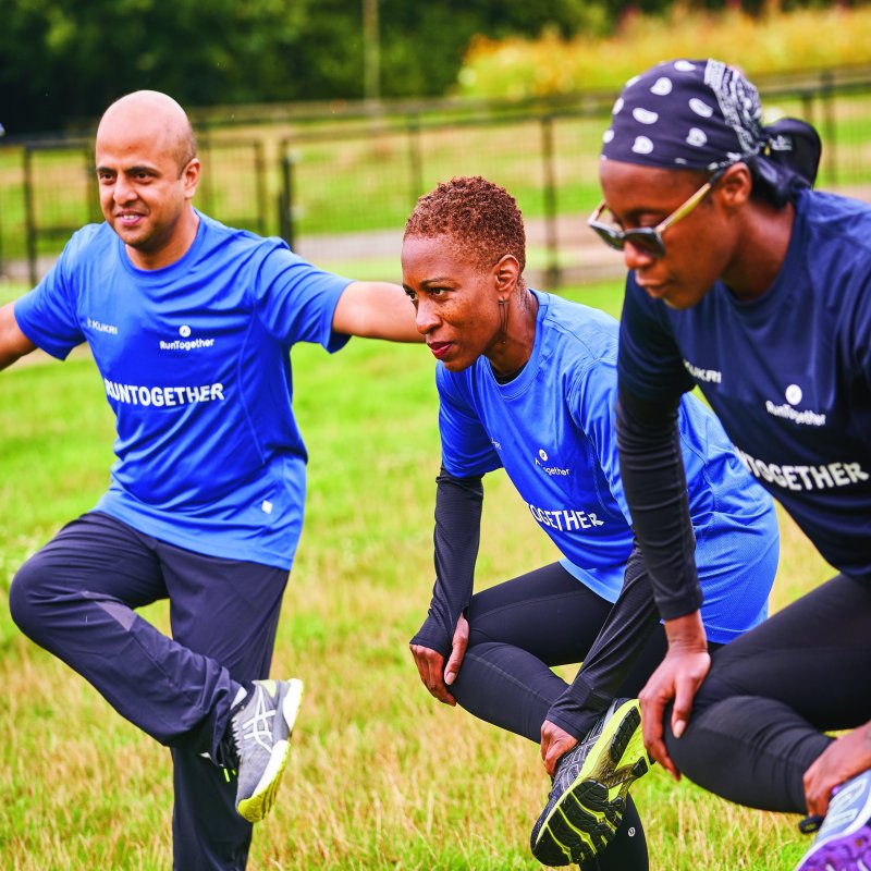 Three RunTogether runners warming up