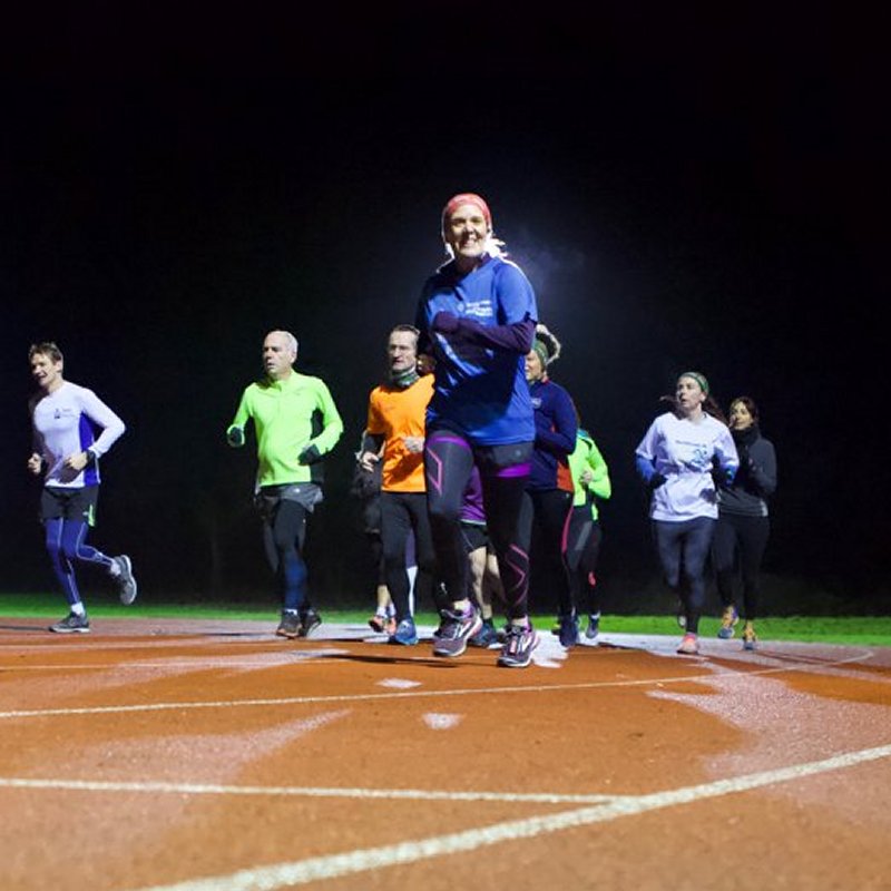 group running on athletics track