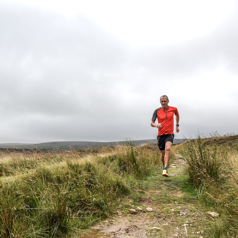 Lone trail runner on moors