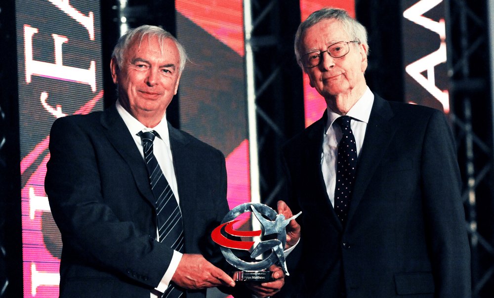 Peter Matthews being presented with his Hall of Fame award by Tony Miller