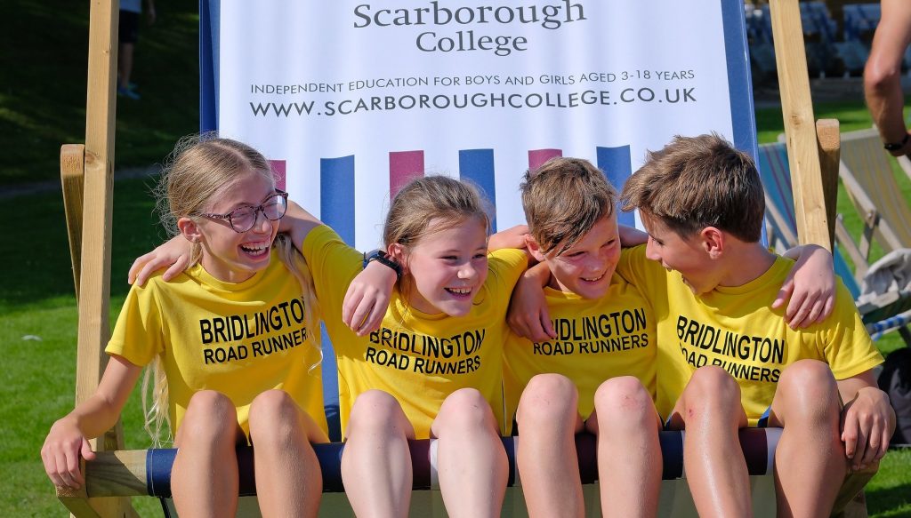 Young athletes on oversized seat