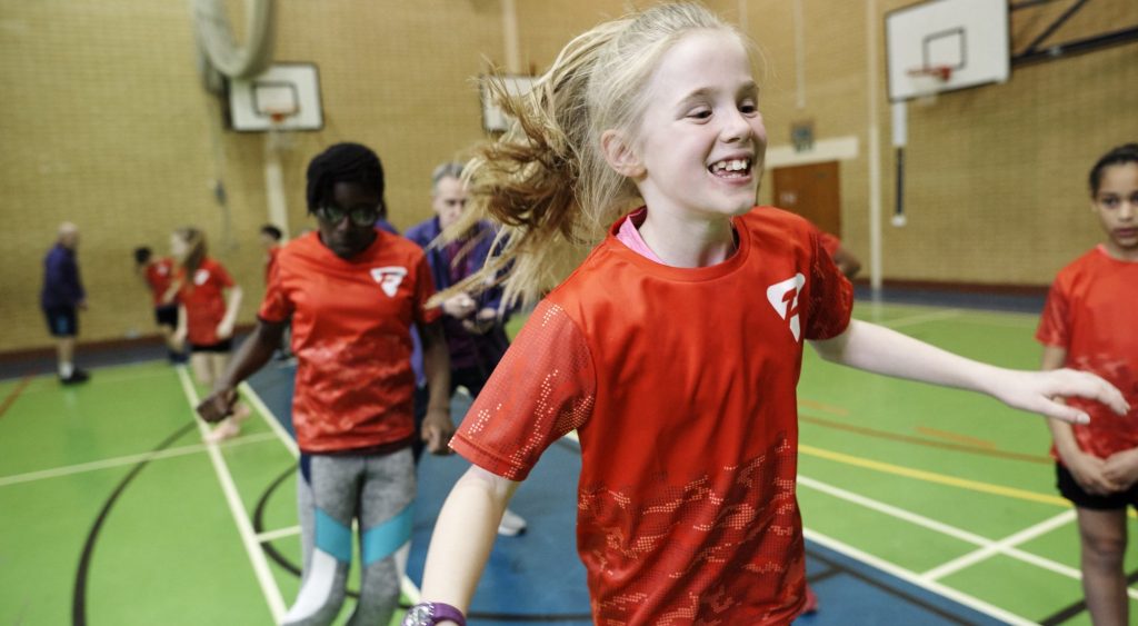girl enjoying funetics in sportshall