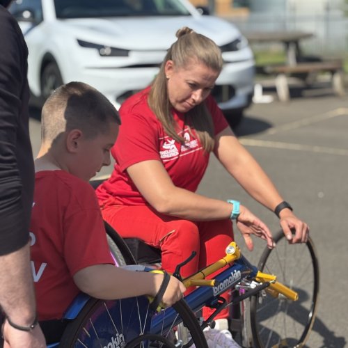 Hannah Cockroft with young wheelchair racer and citroen car