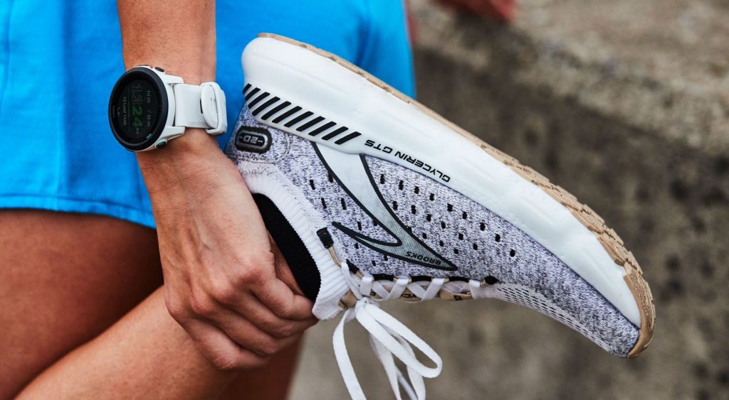 Runner stretching holding ankle