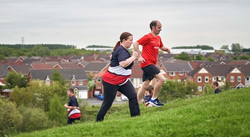 Two RunTogether runners going uphill