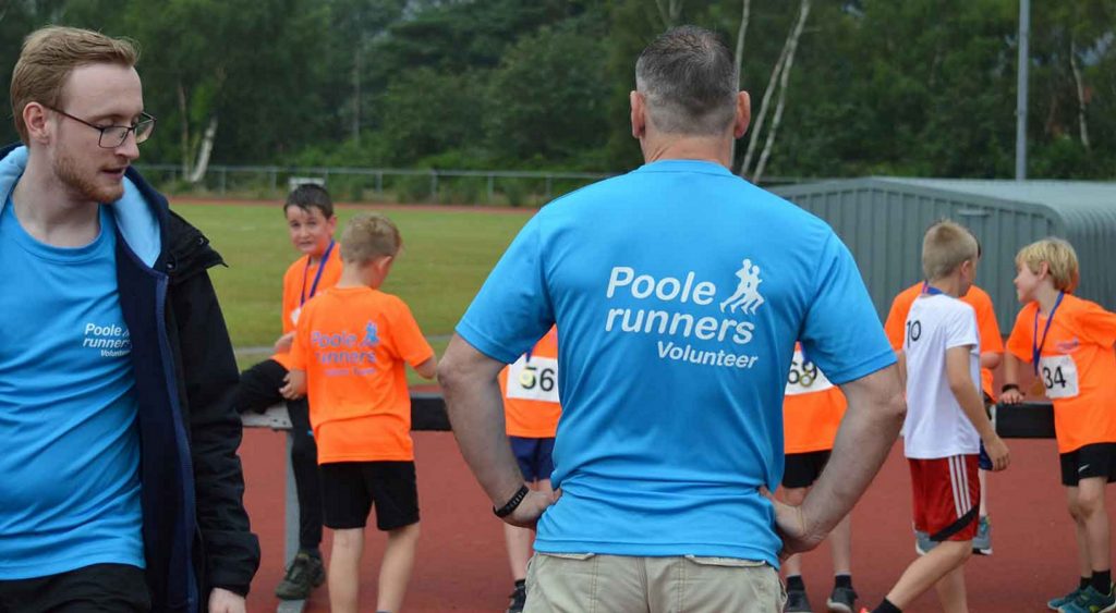 Poole Runners volunteers and young athletes