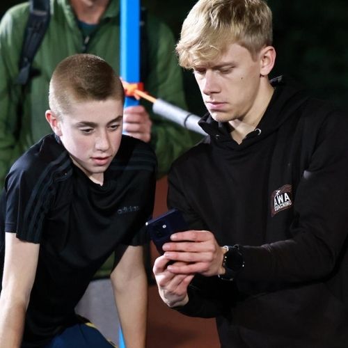 Young coach, Alex Wilson, coaching an athlete