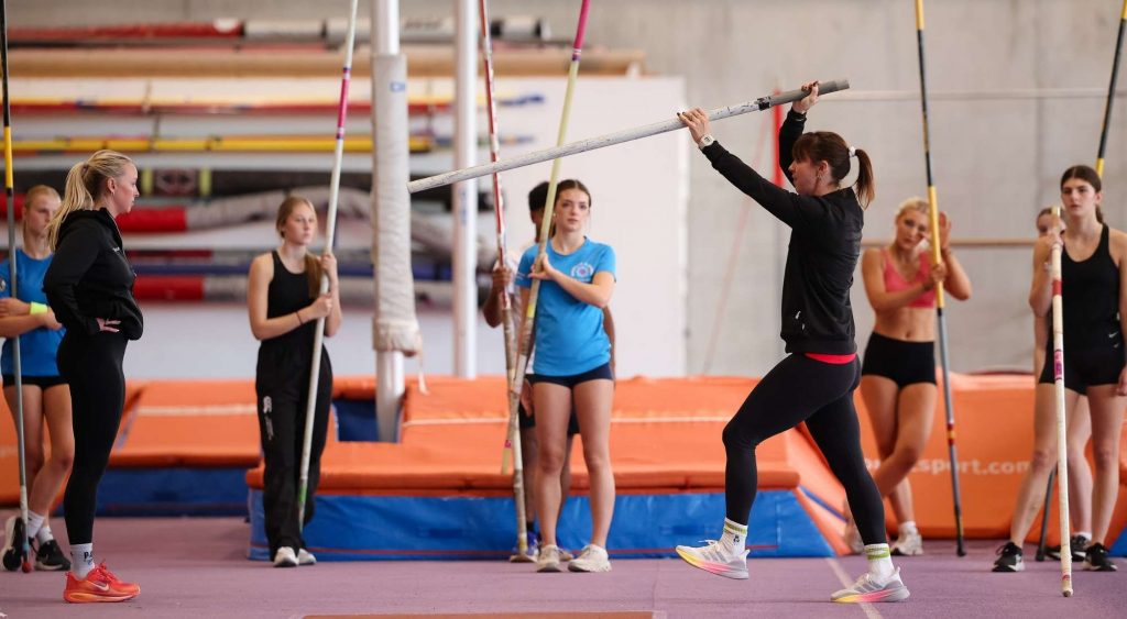 Kate Rooney coaching pole vault at YTP