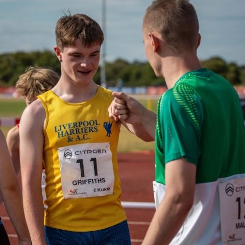 Para athletes fist bumping