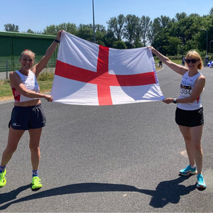 Masters 5k representative race in Shrewsbury - two athletes holding England flag